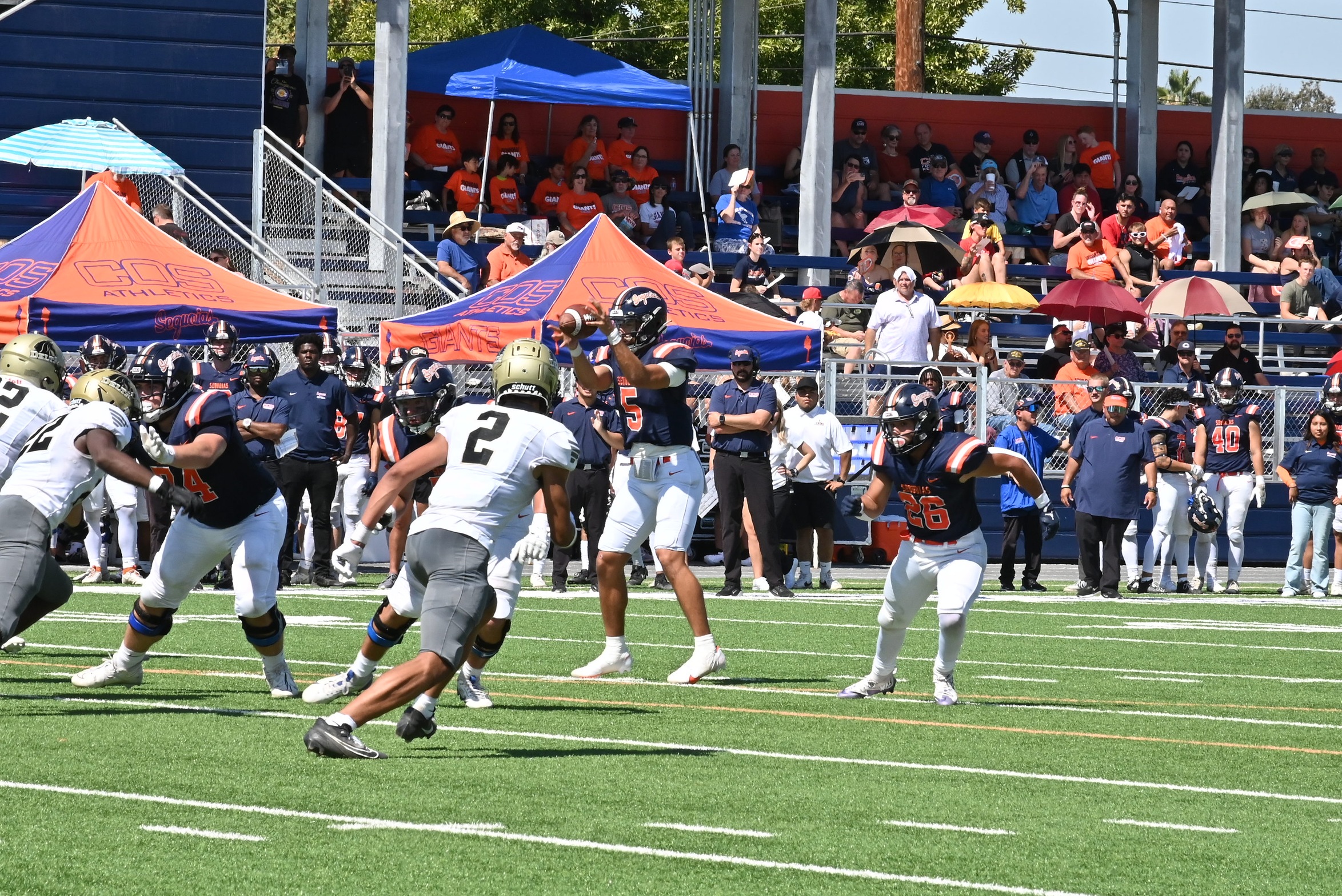 COS Quarterback Reilly Garcia takes a snap earlier in the season.