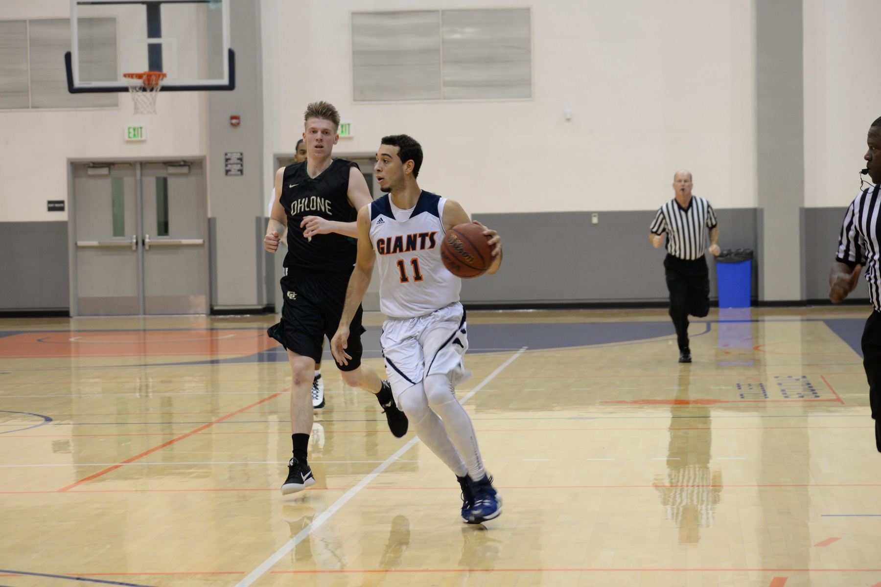 Forward Kentrey Bynum dribbles up the court.